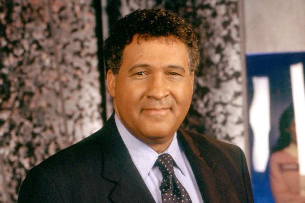 Greg Gumbel, trailblazing sports broadcaster, speaking during a live event.